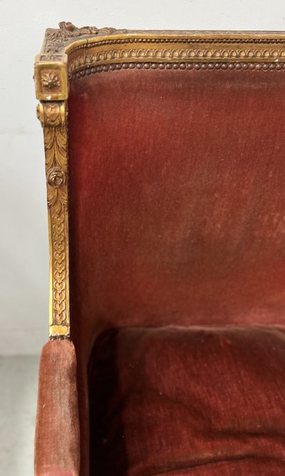 Deux bergères a oreilles de style Louis XVI en bois doré XX siècle