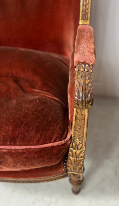 Deux bergères a oreilles de style Louis XVI en bois doré XX siècle