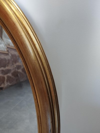 Miroir ovale doré 