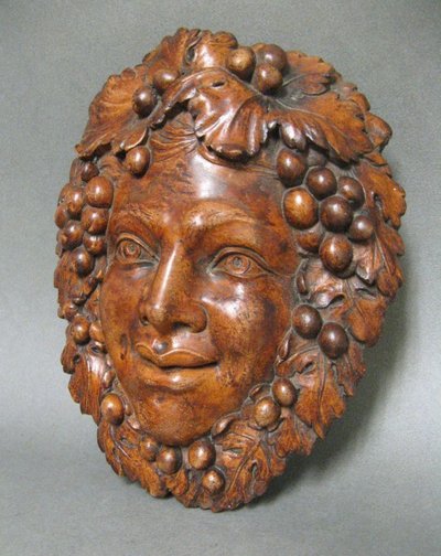 Bacchus head in glazed terracotta.