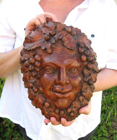 Bacchus head in glazed terracotta.