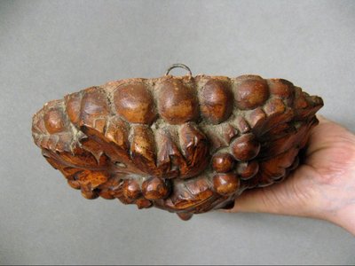 Bacchus head in glazed terracotta.