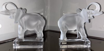 LALIQUE France Pair of Éléphants bookends in moulded and satin-finish crystal.