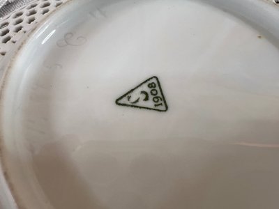 Openwork white porcelain cup and saucer - Manufacture de Sèvres, dated 1908