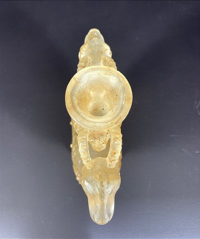 China, Qing Dynasty, early 19th century, candlestick in the form of a small vase surrounded by two rams.