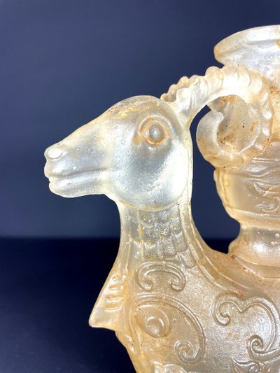 China, Qing Dynasty, early 19th century, candlestick in the form of a small vase surrounded by two rams.