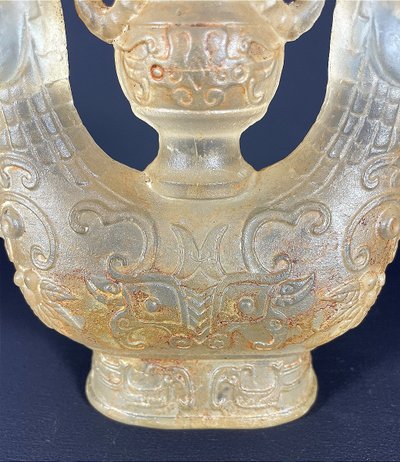 China, Qing Dynasty, early 19th century, candlestick in the form of a small vase surrounded by two rams.