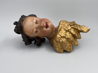 Head of a cherub in carved polychrome and gilded wood, 17th century, entourage of Ignaz Günther