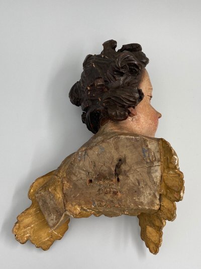 Head of a cherub in carved polychrome and gilded wood, 17th century, entourage of Ignaz Günther