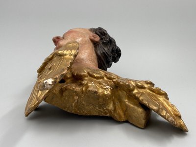 Head of a cherub in carved polychrome and gilded wood, 17th century, entourage of Ignaz Günther