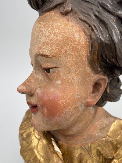 Head of a cherub in carved polychrome and gilded wood, 17th century, entourage of Ignaz Günther