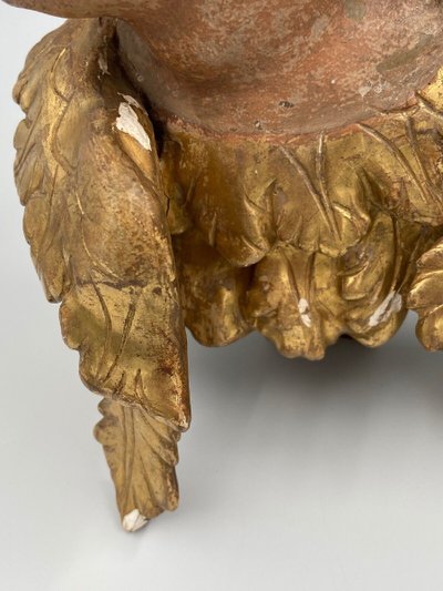 Head of a cherub in carved polychrome and gilded wood, 17th century, entourage of Ignaz Günther