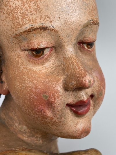 Head of a cherub in carved polychrome and gilded wood, 17th century, entourage of Ignaz Günther
