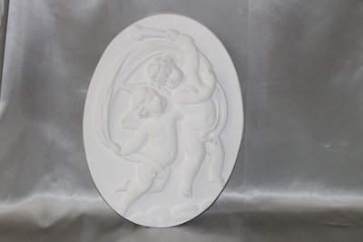 Pair of plaster bas-reliefs decorated with cherubs in the Louis XVI style, 20th century.