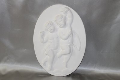 Pair of plaster bas-reliefs decorated with cherubs in the Louis XVI style, 20th century.
