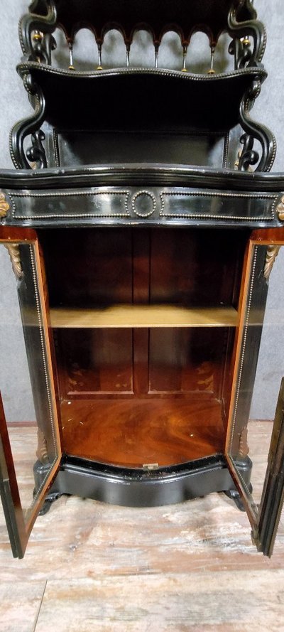 Napoleon III period "Boulle" curved display case in blackened wood and gilded wood circa 1850