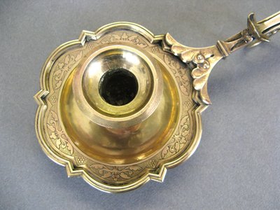 Bronze bishop candlestick with episcopal hand.