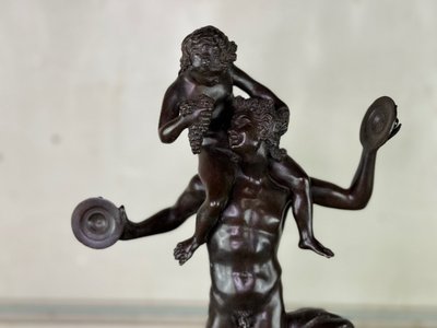 Dionysus on the Shoulders of a Satyr, Bronze after the Antique on a Sienna Yellow Base