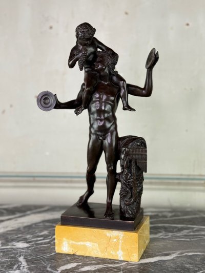 Dionysus on the Shoulders of a Satyr, Bronze after the Antique on a Sienna Yellow Base