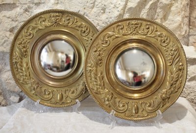 Pair of late 19th century embossed brass witch mirrors