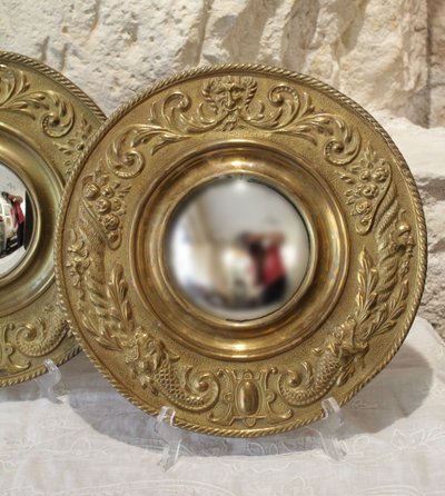 Pair of late 19th century embossed brass witch mirrors