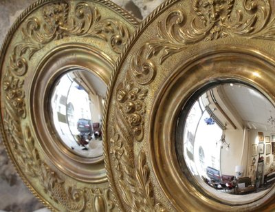 Pair of late 19th century embossed brass witch mirrors