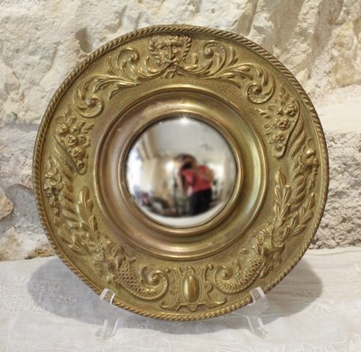 Pair of late 19th century embossed brass witch mirrors