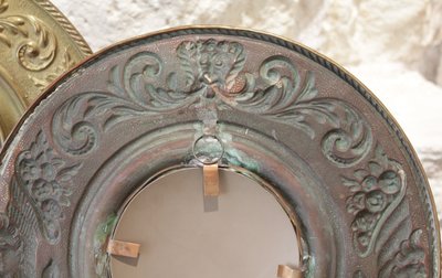 Pair of late 19th century embossed brass witch mirrors