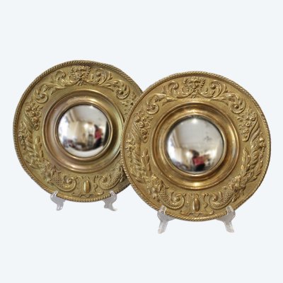 Pair of late 19th century embossed brass witch mirrors