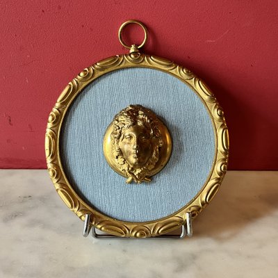 Pair of medallions, Bacchus, gilded bronze