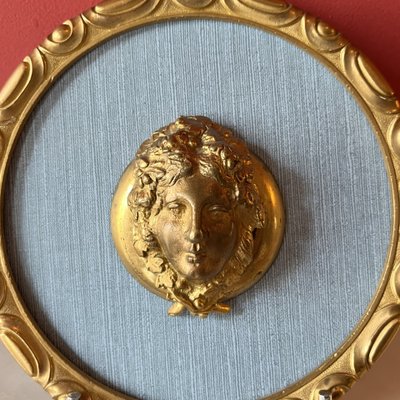 Pair of medallions, Bacchus, gilded bronze