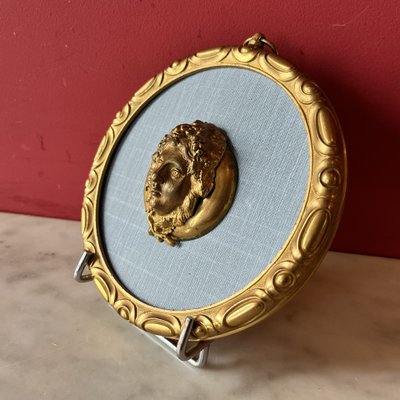 Pair of medallions, Bacchus, gilded bronze