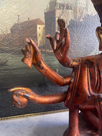 Vietnamese statue representing Quan Am in red and gilded wood