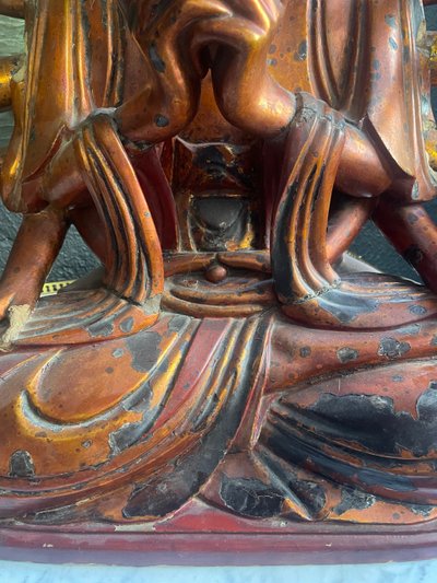 Vietnamese statue representing Quan Am in red and gilded wood