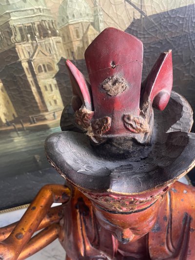 Vietnamese statue representing Quan Am in red and gilded wood