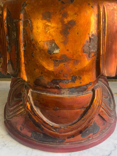 Vietnamese statue representing Quan Am in red and gilded wood