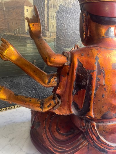 Vietnamese statue representing Quan Am in red and gilded wood
