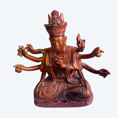 Vietnamese statue representing Quan Am in red and gilded wood