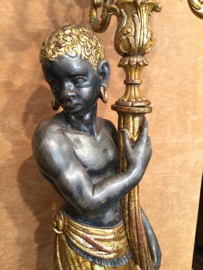 A large "Nubian" floor lamp in the Italian Baroque style, in painted and gilded wood.
