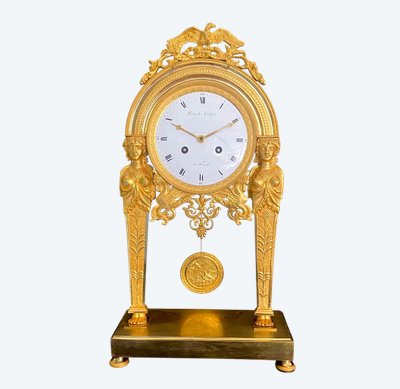 ManteL CLOCK with chiseled and gilded bronze caryatids, empire period