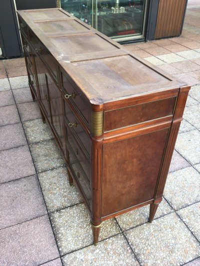 A Louis XVI-style enfilade sideboard in varnished mahogany