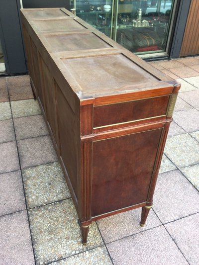 A Louis XVI-style enfilade sideboard in varnished mahogany