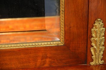 Showcase from the Empire period in mahogany and gilt bronze.