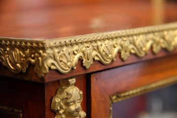 Showcase from the Empire period in mahogany and gilt bronze.