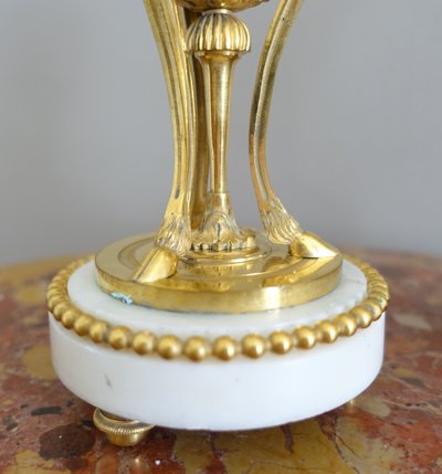 Pair of Louis XVI style marble ormolu cassolettes with upside-down candlesticks