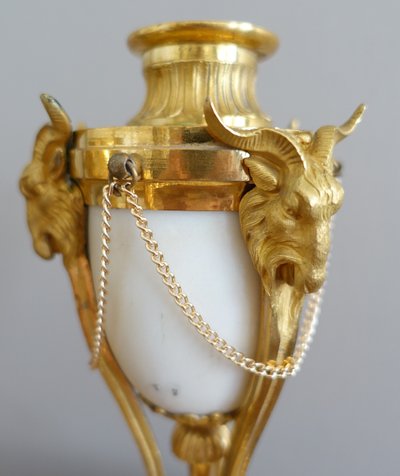 Pair of Louis XVI style marble ormolu cassolettes with upside-down candlesticks