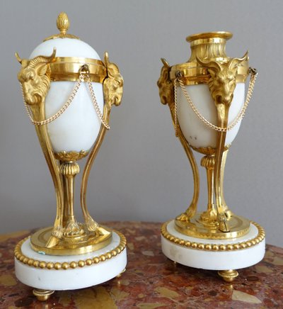 Pair of Louis XVI style marble ormolu cassolettes with upside-down candlesticks