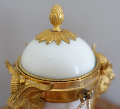 Pair of Louis XVI style marble ormolu cassolettes with upside-down candlesticks