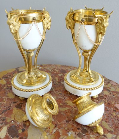 Pair of Louis XVI style marble ormolu cassolettes with upside-down candlesticks