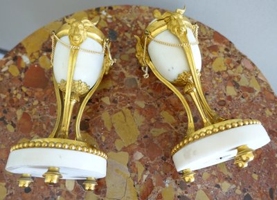 Pair of Louis XVI style marble ormolu cassolettes with upside-down candlesticks